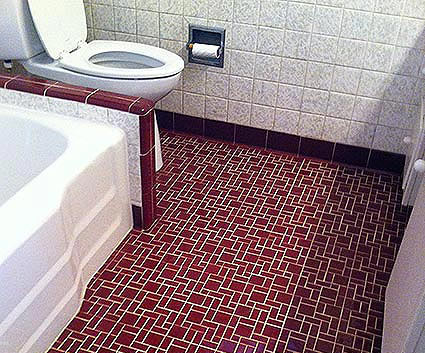 Tile flooring in a bathroom after being professionally cleaned.