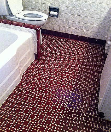 Tile flooring in a bathroom after being professionally cleaned.